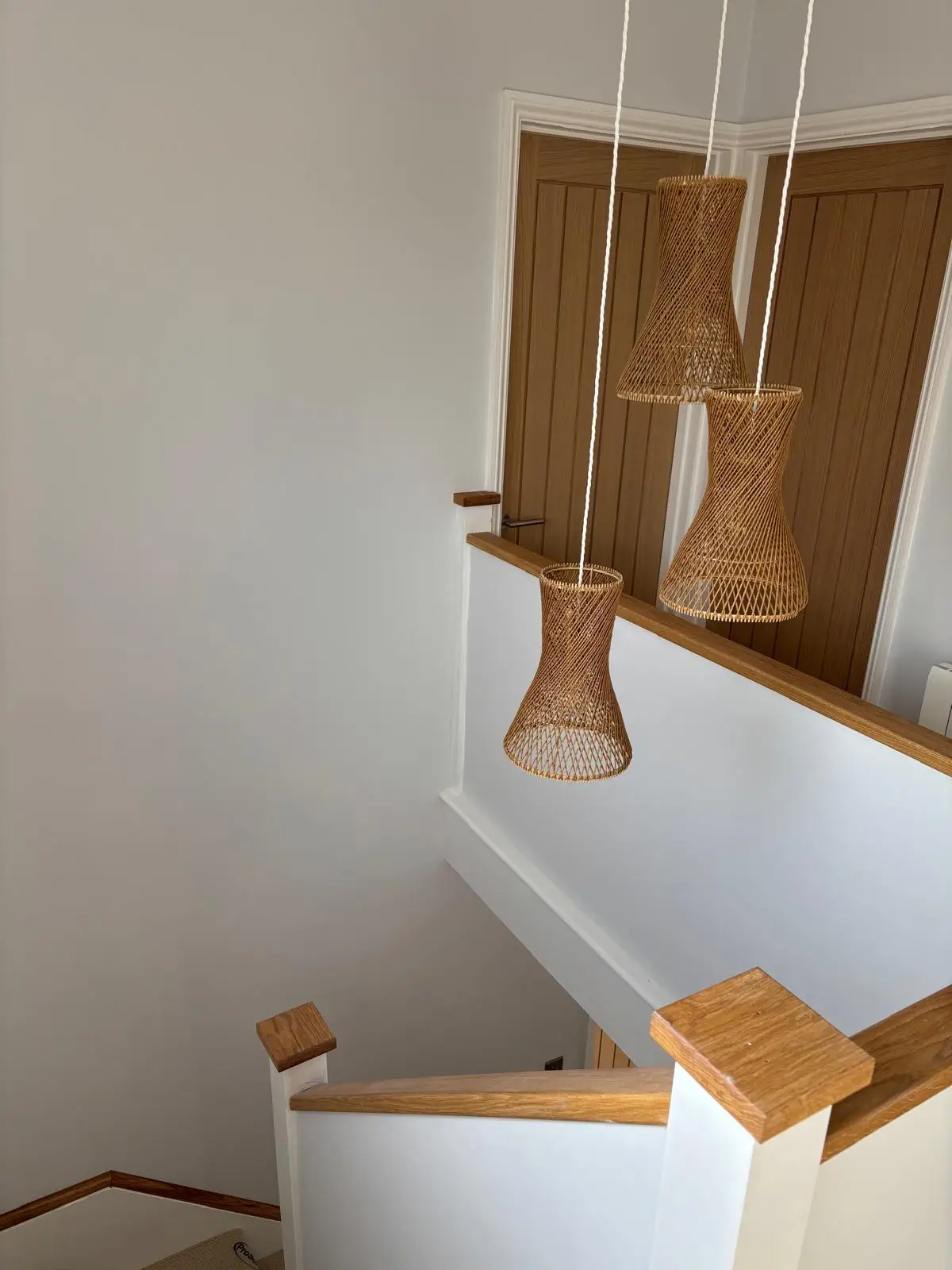 After — stairwell pendant cluster
