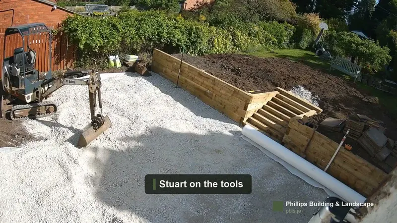 Mid-rebuild in Staffordshire — timber sleeper walls, new steps and patio sub-base going in